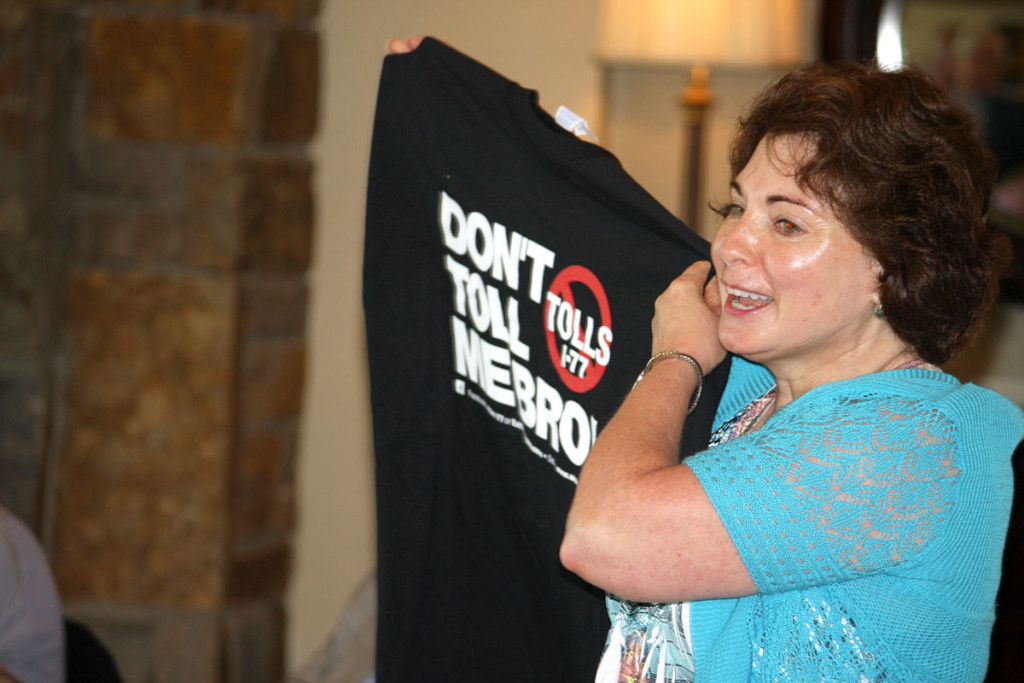 Anti-toll activist Sharon Hudson displays an anti-toll t-shirt