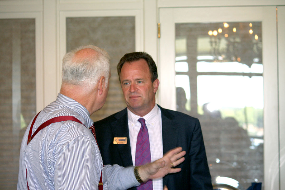 Mecklenburg County commissioner talks to Aquesta's Jim Engel after the breakfast