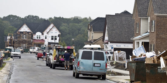 Workers line Marigold Place in the Blume subdivision in Harrisburg, NC.  150 homes have been built since construction began in 2013.  With 297 lots planned multiple homes are under construction with lots selling quickly. Photo by Marty Price