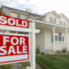 Sold Home For Sale Sign in front of Beautiful New Home.