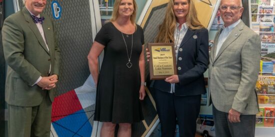 Candace Bongiovanni, with CoCo Couture – Lake Norman, receives the 2019 Cornelius Small Business of the Year from Chamber Board Chair Tricia Sisson, Mayor Woody Washam and President Bill Russell.  The event was not held in 2020 due to the Covid-19 pandemic. 