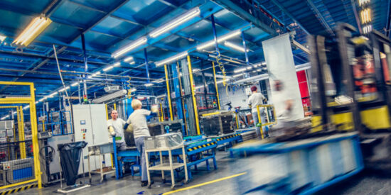 Blurred_forklift_and_factory_workers_SmartCropSixteenToNine