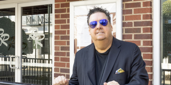 Ron Herbert in front of Red Rocks Cafe in Birkdale Village.