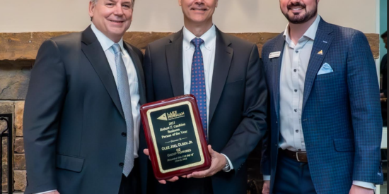 LKN Chamber recognizes business leaders Joel Olsen receives Business Person of the Year award from 2023 LKN Chamber Chair Douglas Marion and Bobby Cashion representing the Cashion family. The award is named for the late Robert T. Cashion. Photo: John McHugh / Ocaid Photography