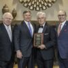 Mike Cook from Cavin Cook Funeral Home and Crematory receives the Robert T. Cashion Business Person of the Year from Bobby Cashion. Also pictured is Cook’s longtime friend Randy Marion and 2024 Board Chair Jeff Tarte. Photo by John McHugh / Ocaid Photography
